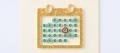 Paper quilling of a wall calendar made of teal paper coils, with several days circled and one circled in orange