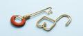 Brass wire sculpture of a key with a burnt-orange thread-wrapped bow beside an open padlock