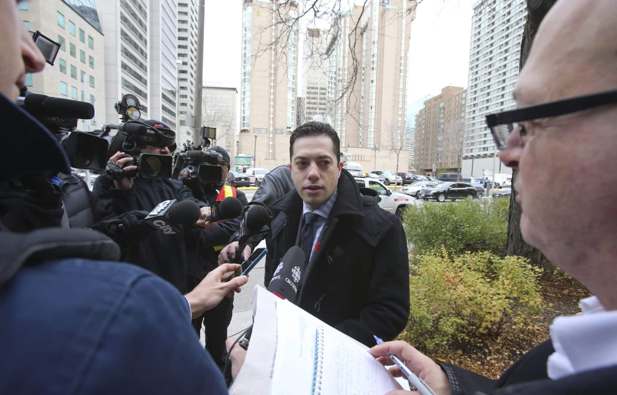 Daniel Brown speaking to reporters in a media scrum