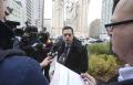 Daniel Brown speaking to reporters in a media scrum