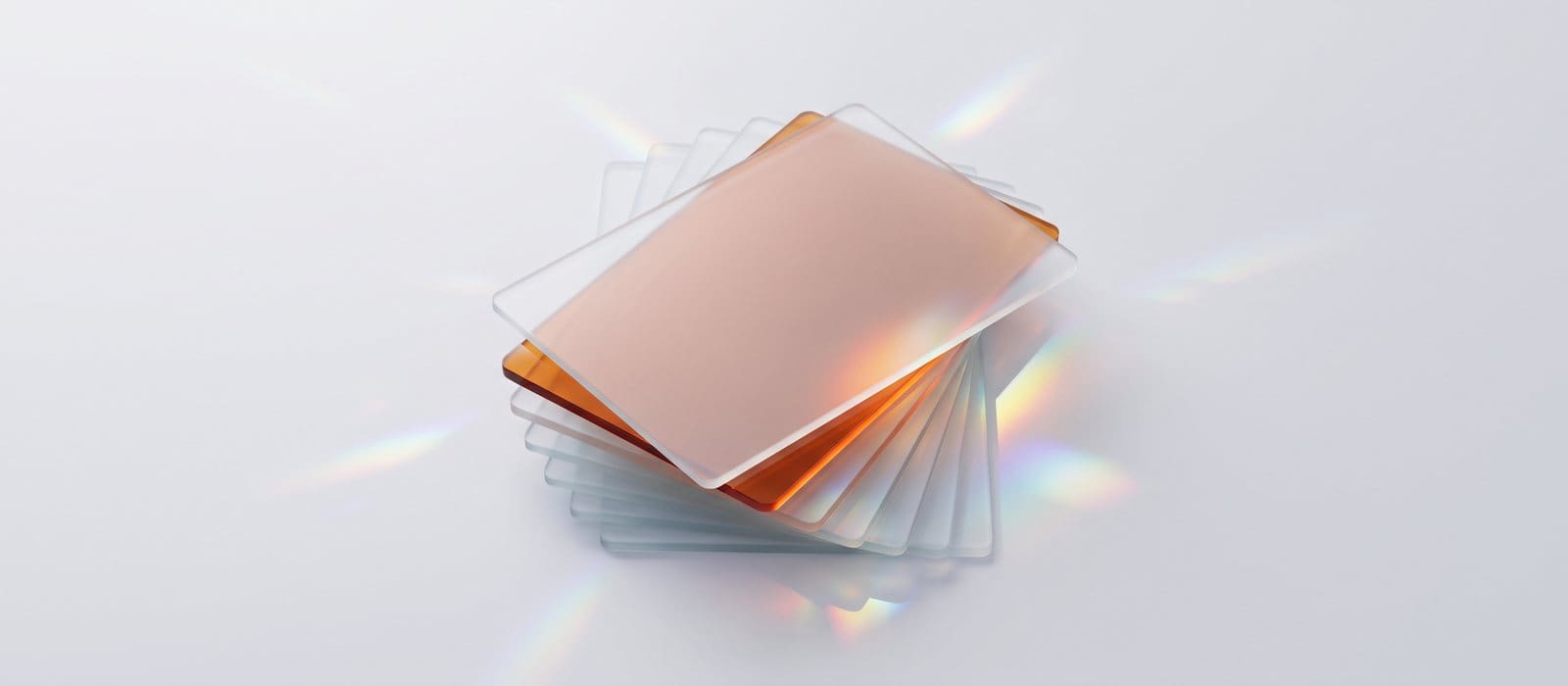 Stack of blank frosted glass report sheets with one orange sheet