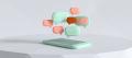 Low-poly 3D render of a smartphone lying on a table with blank mint and coral message bubbles above it, one burnt orange