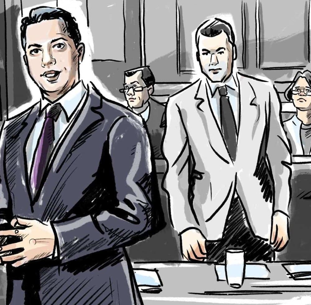 Court sketch of defence counsel standing at the counsel table in a courtroom